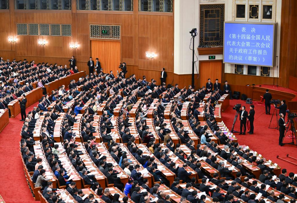 3月11日，第十四屆全國人民代表大會第二次會議在北京人民大會堂舉行閉幕會。新華社記者 牟宇 攝